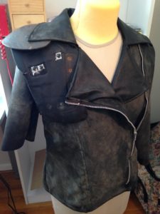A handmade cosplay version of Mad Max's jacket on a dress form.