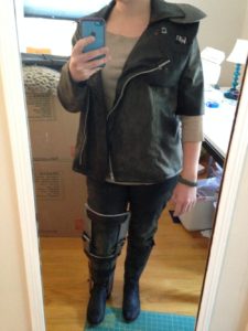A selfie of my mad max cosplay, with dirty thermal shirt, jacket, faux leather pants, boots, and handmade leg brace.
