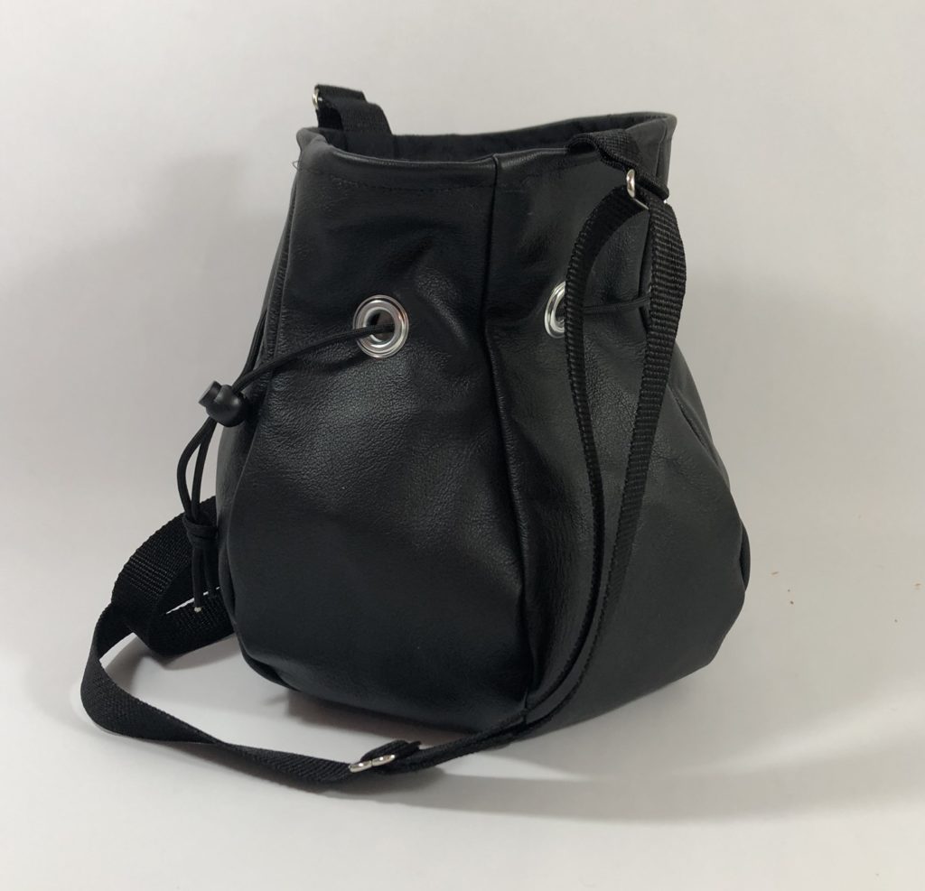 Black leather drawstring handbag.
