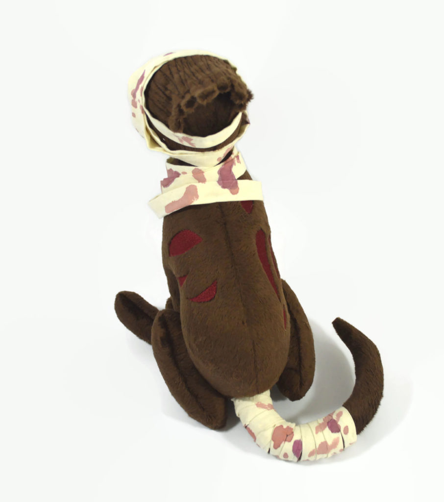 Back view of the zombie dog plush.